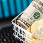 gold-bitcoin-coins-and-cash-in-a-miniature-shopping-cart