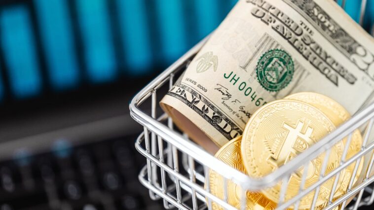 gold-bitcoin-coins-and-cash-in-a-miniature-shopping-cart