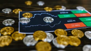 selective-focus-photo-of-silver-and-gold-bitcoins
