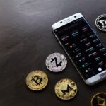 silver-gold-crypto-coin-iphone-on-table